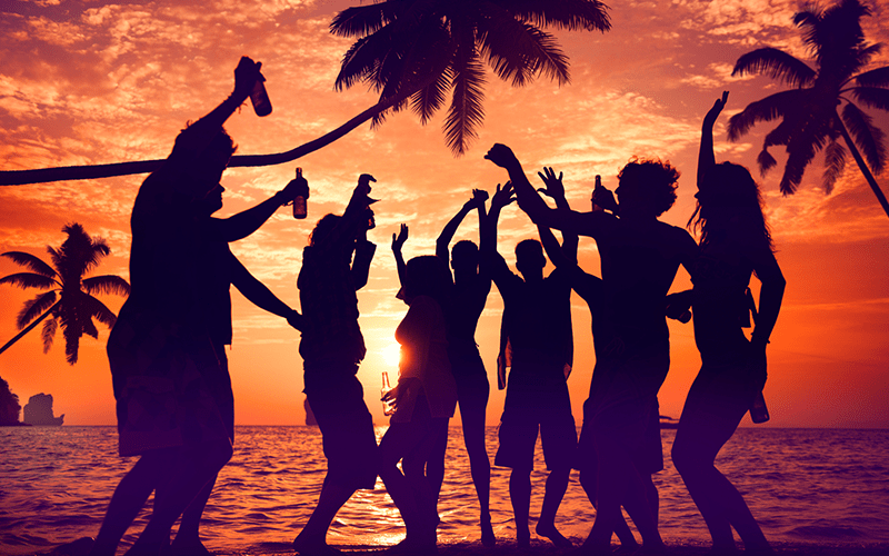 Group of people at dusk partying at the Durban Peachy Beach Party. EbonyModex girls event run by LoveDurban.co.za Tourist information and what's on in durban events guide. Durban South Africa