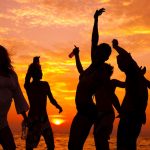 Group of people at dusk partying at the Durban Peachy Beach Party. EbonyModex girls event run by LoveDurban.co.za Tourist information and what's on in durban events guide. Durban South Africa