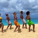 Durban Peachy Beach Party. 5 people on a beach in Durban dancing on the beach at our peachy beach party